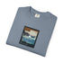 Folded blue t-shirt with a graphic design on a white background