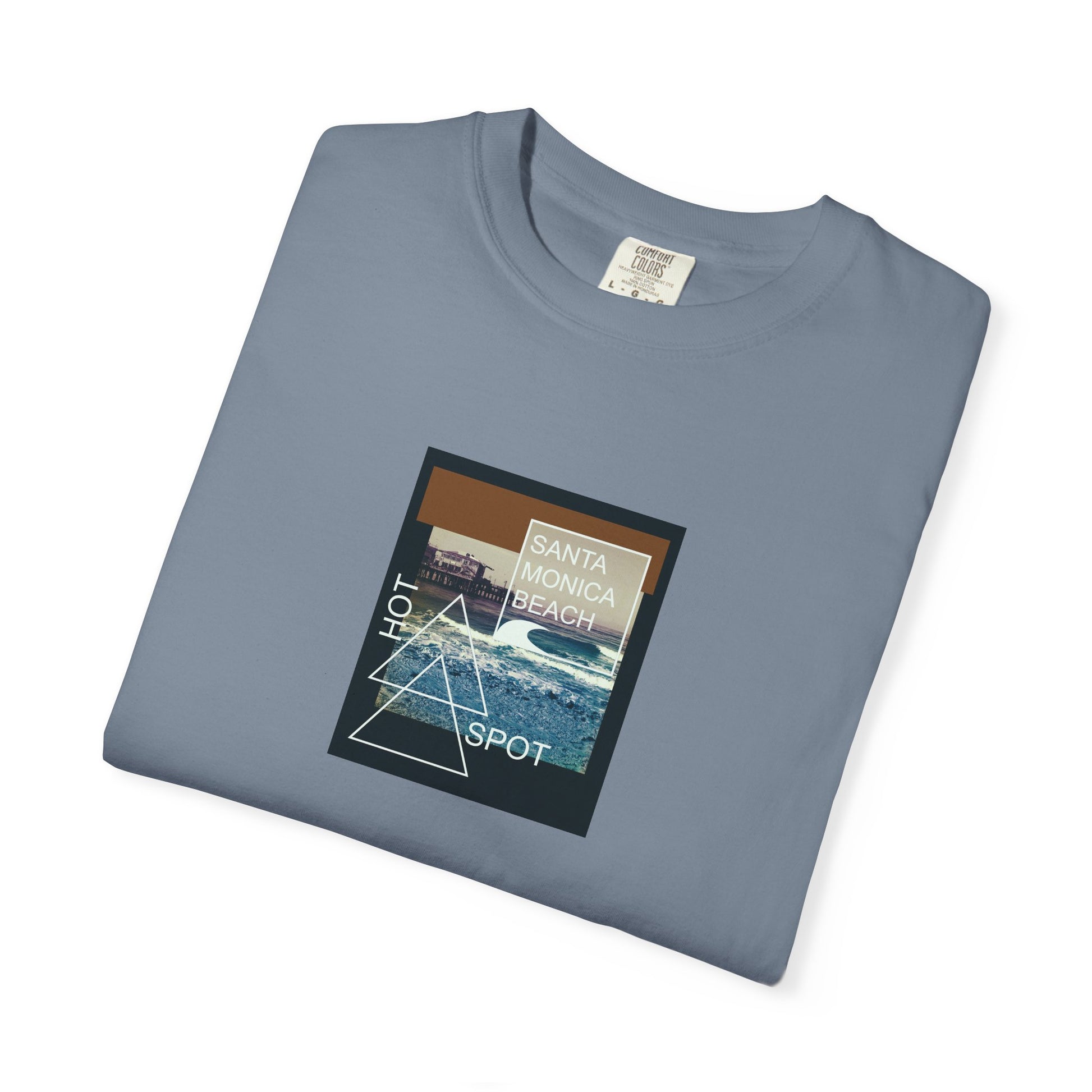 Folded blue t-shirt with a graphic design on a white background