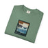 Folded green t-shirt with a graphic design on a white background