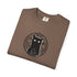A brown folded crewneck t-shirt featuring a black graphic of a cat inside a circular occult-style symbol, displayed on a clean white background.