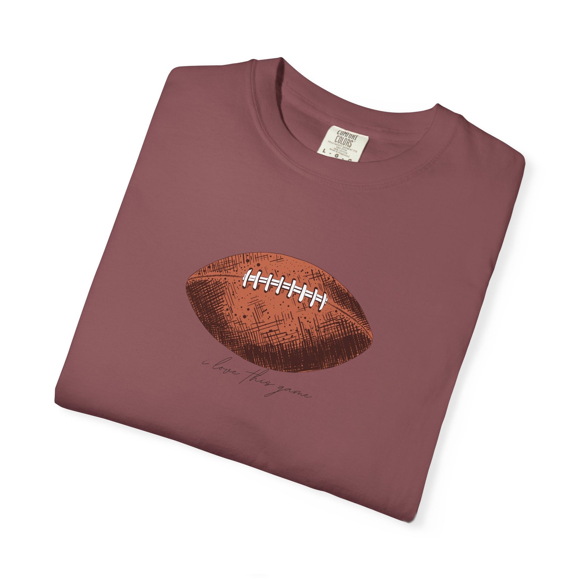 Maroon t-shirt with a football graphic on a white background