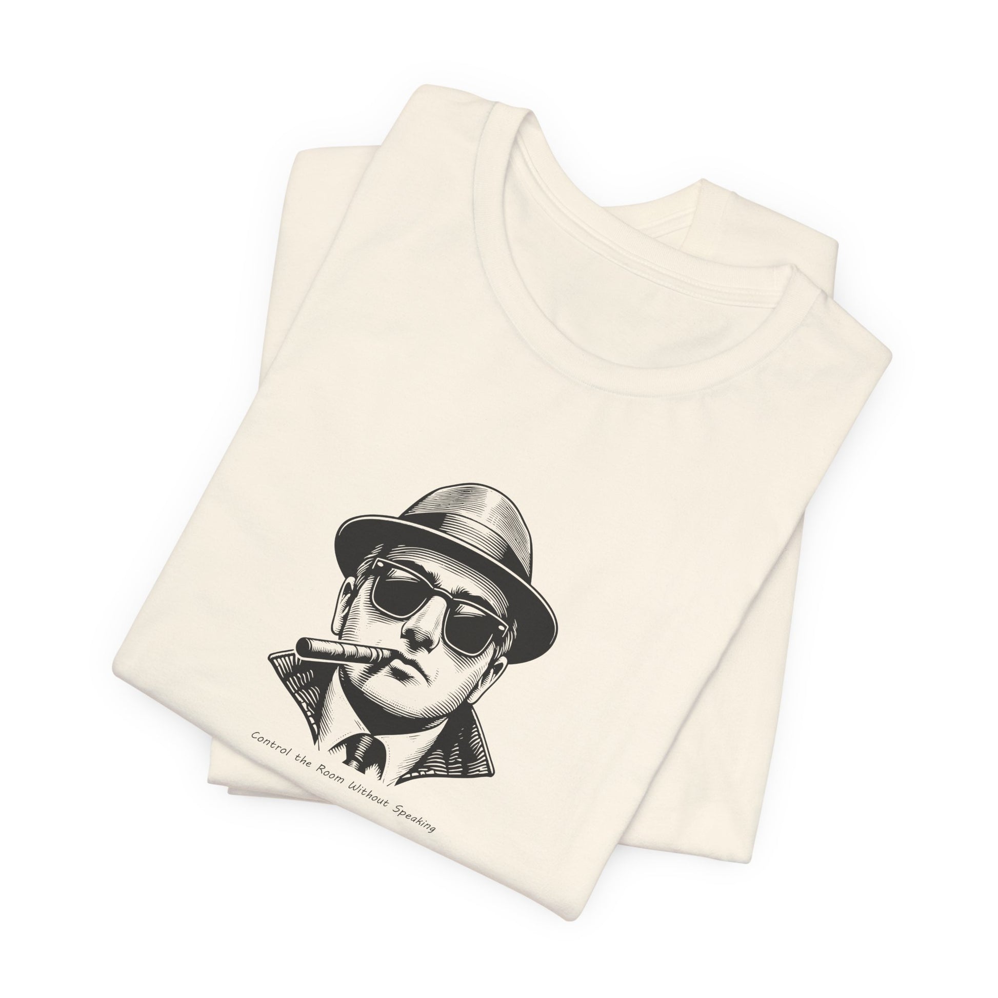 Folded tank top with a graphic of a person wearing a hat and sunglasses on a white background