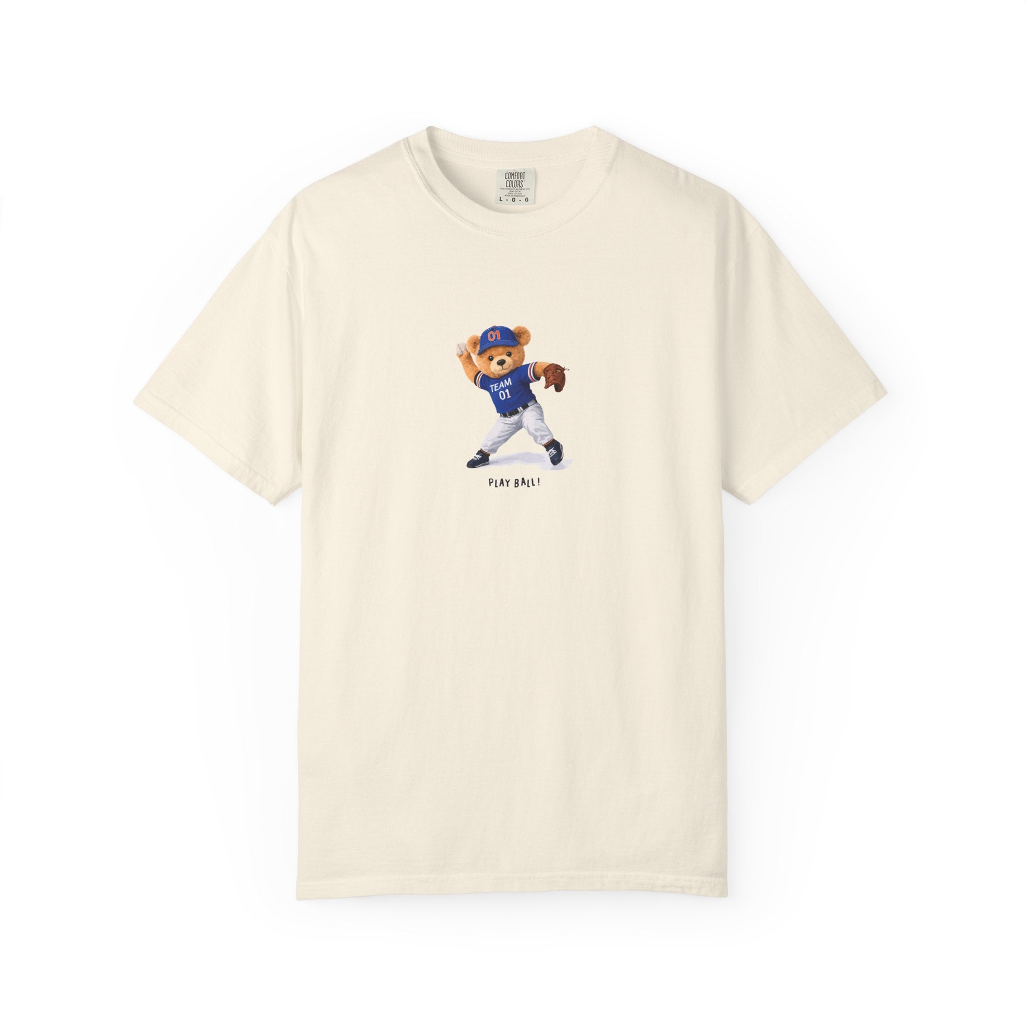 Beige t-shirt with a bear wearing a blue baseball uniform on a cream background