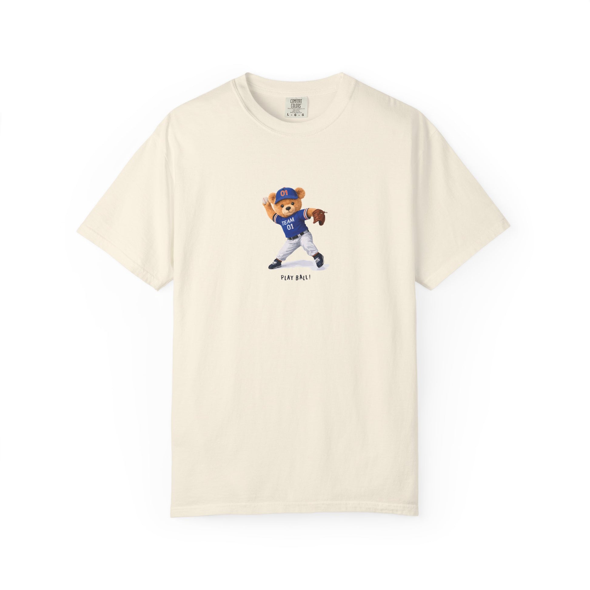 Beige t-shirt with a bear wearing a blue baseball uniform on a cream background