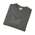 Folded green t-shirt with a logo and text on a white background