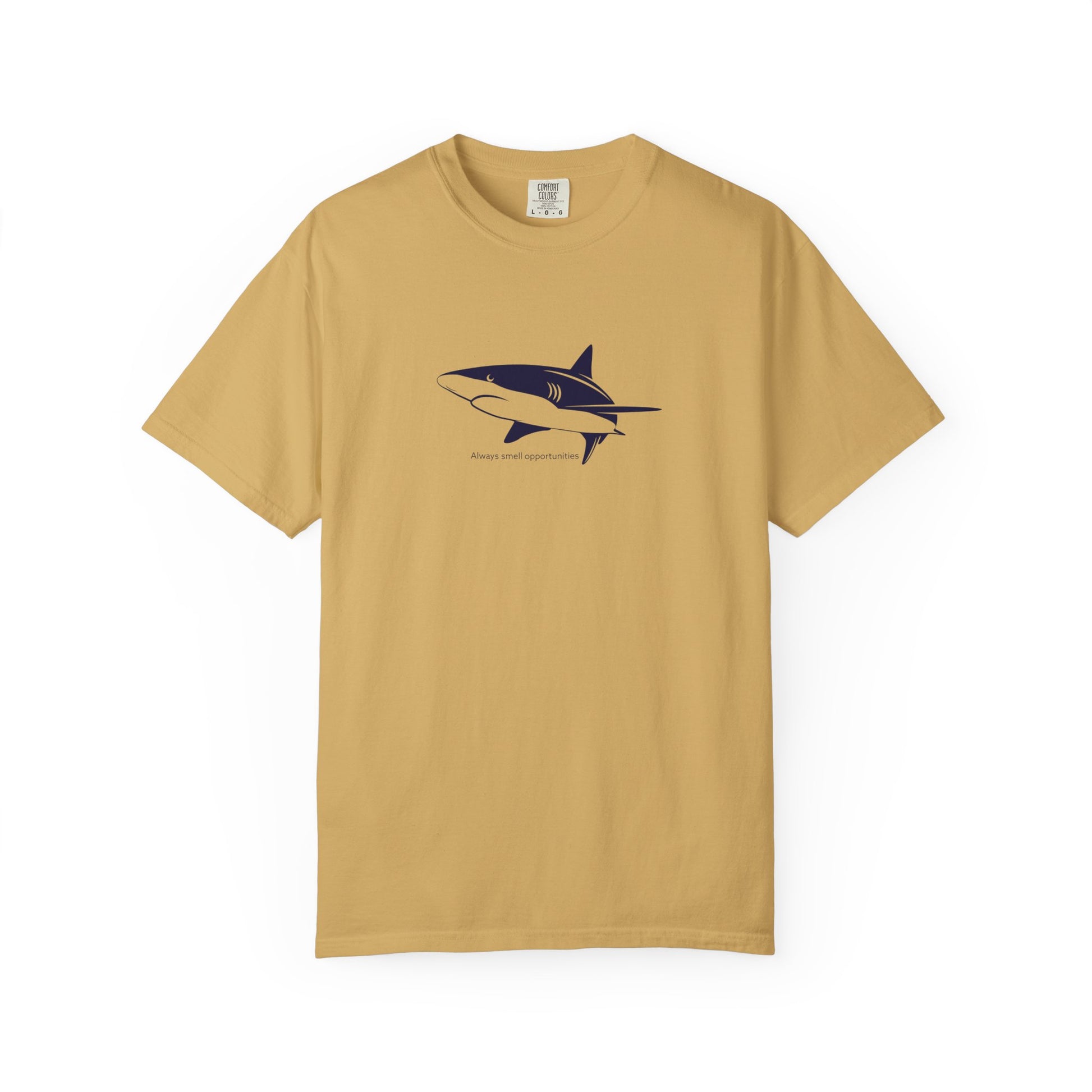Beige t-shirt with a shark graphic on a white background