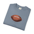 Folded blue t-shirt with a brown football graphic on a white background