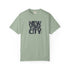 Green t-shirt with 'New York City' text on a white background