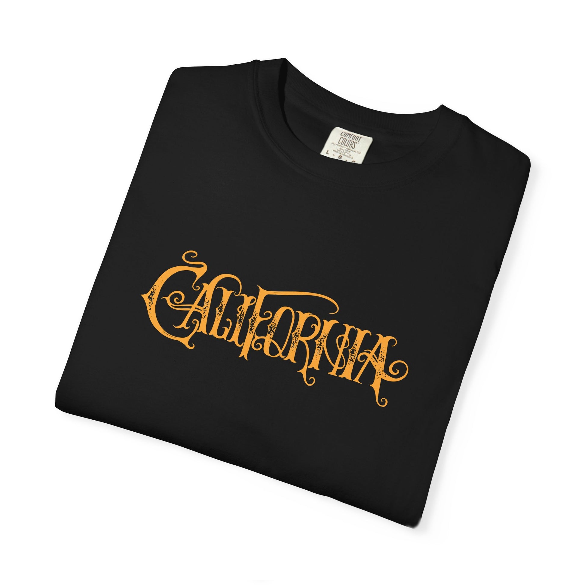 A folded black t-shirt with 'CALIFORNIA' printed in a stylized, ornate orange font across the chest, displayed on a clean white background.