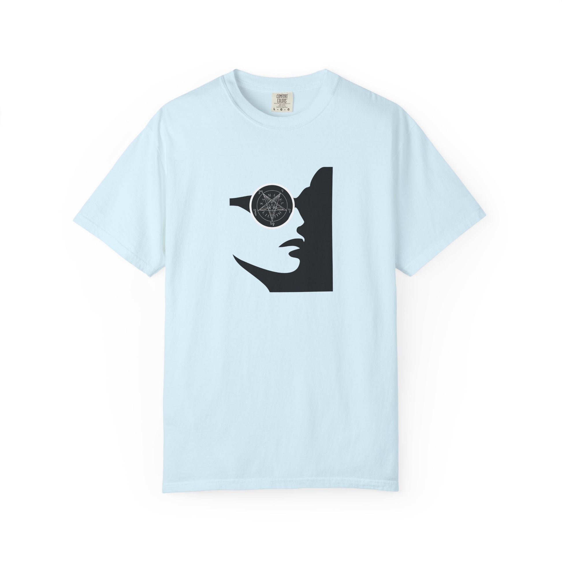 A light blue short-sleeve crewneck t-shirt featuring a black graphic print of a woman's profile with a pentagram symbol in her eye, displayed on a clean white background.