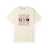 An off-white short-sleeve t-shirt with a central graphic of a pentagram, moon phases, and circular symbols in dark red and black, surrounded by circular text.