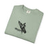 Folded green t-shirt with a black graphic design on a white background