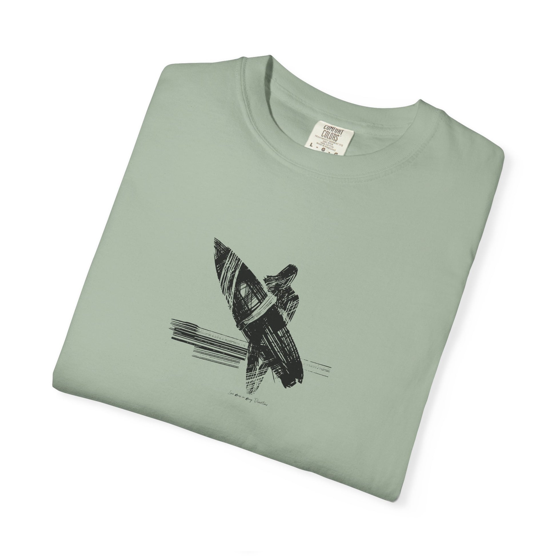 Folded green t-shirt with a black graphic design on a white background