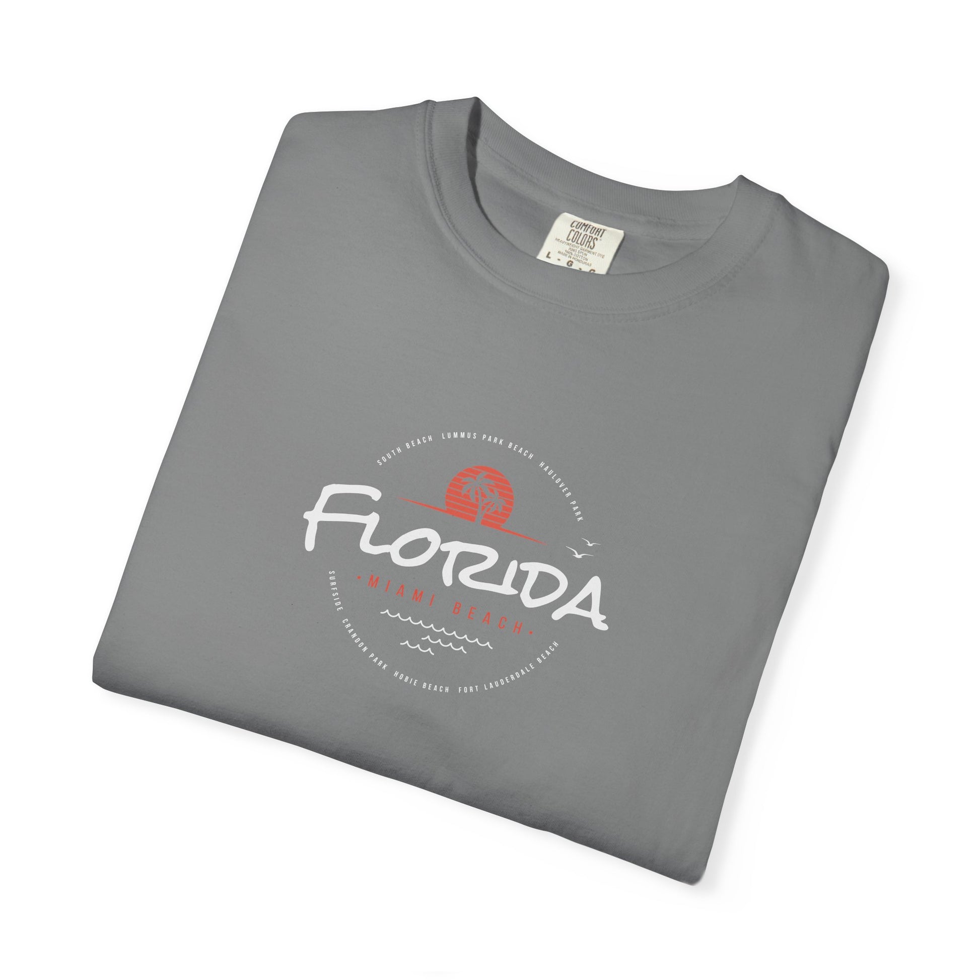 Folded blue t-shirt with 'professional procrastinator' text on a white background
