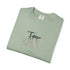 Folded green t-shirt with a red heart and hands design on a white background