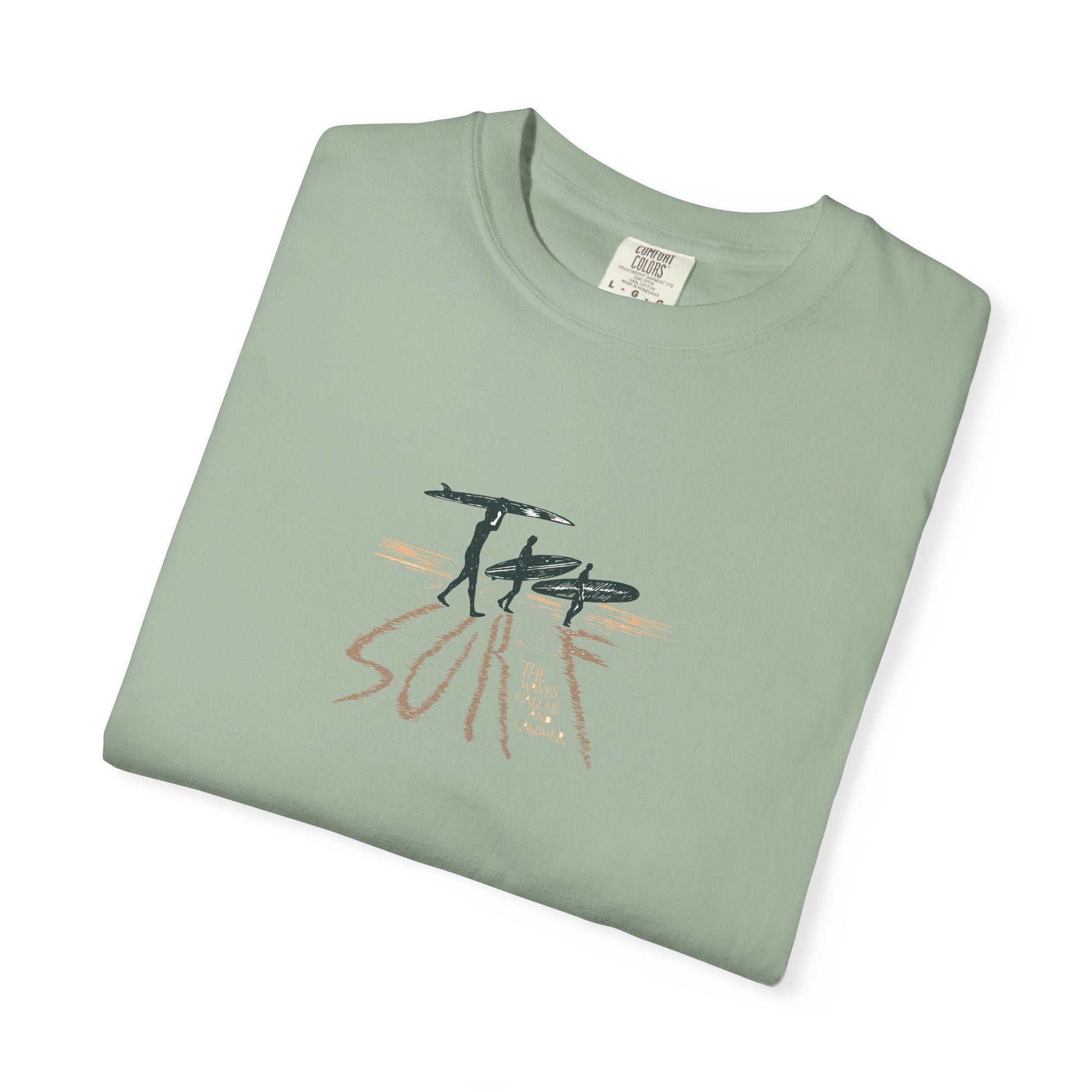 Folded green t-shirt with a red heart and hands design on a white background