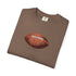 Folded brown t-shirt with a football graphic on a white background