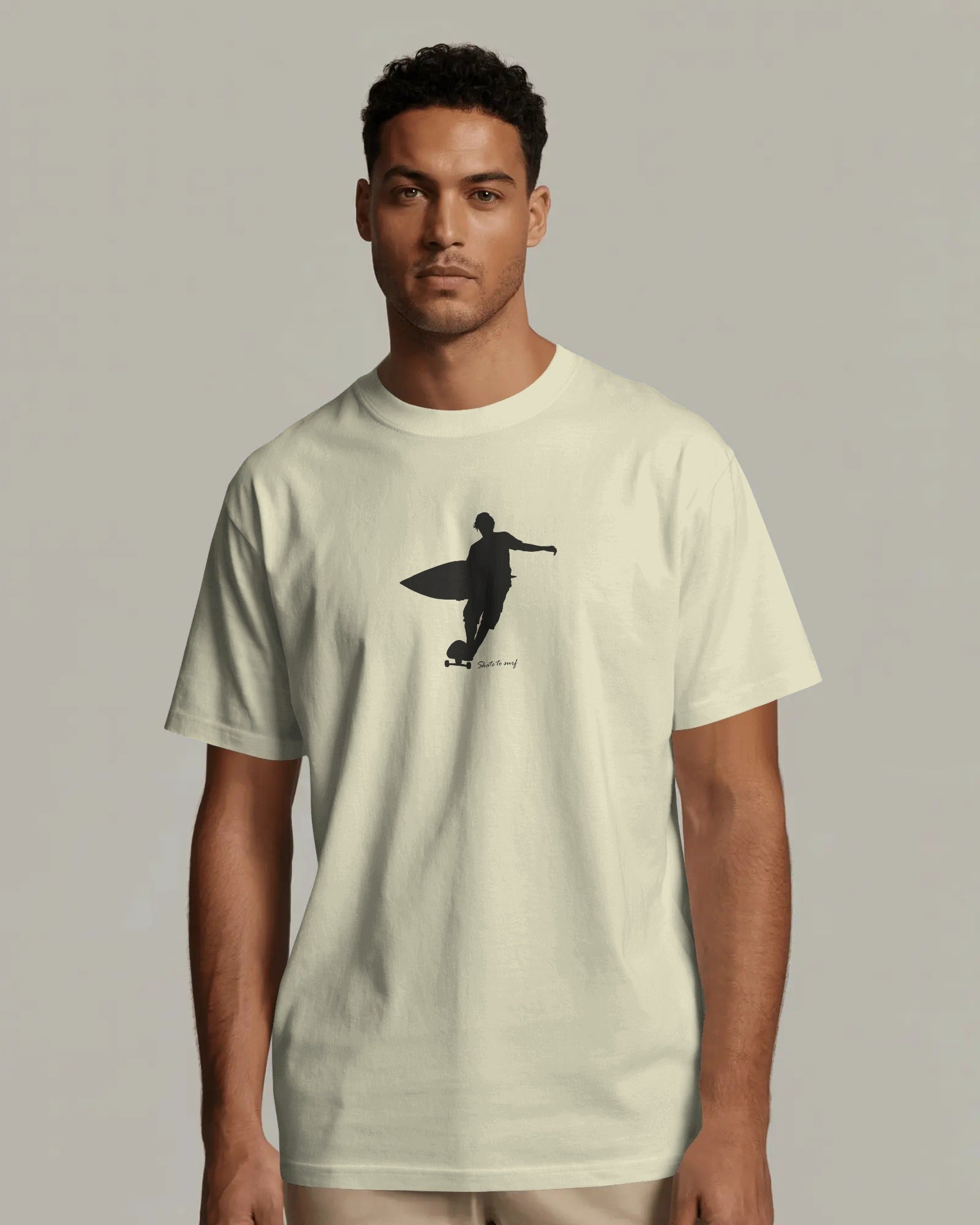 Minimal surfer silhouette graphic t-shirt with surfboard coastal surf design