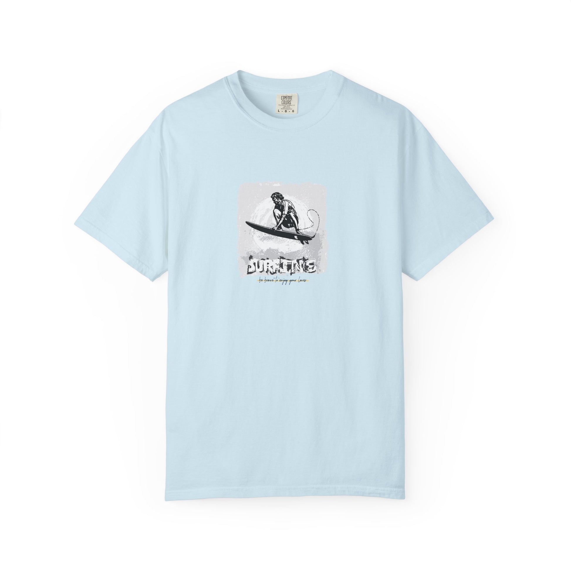 Light blue t-shirt with a graphic of a person on a surfboard and text on a white background