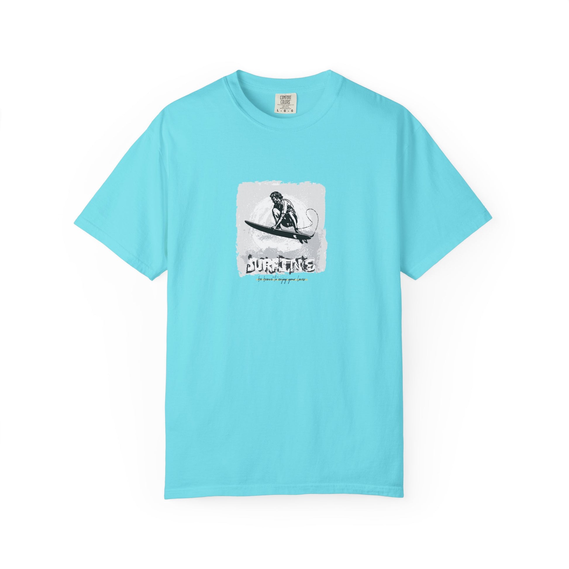 Light blue t-shirt with a graphic of a person on a surfboard and text on a white background