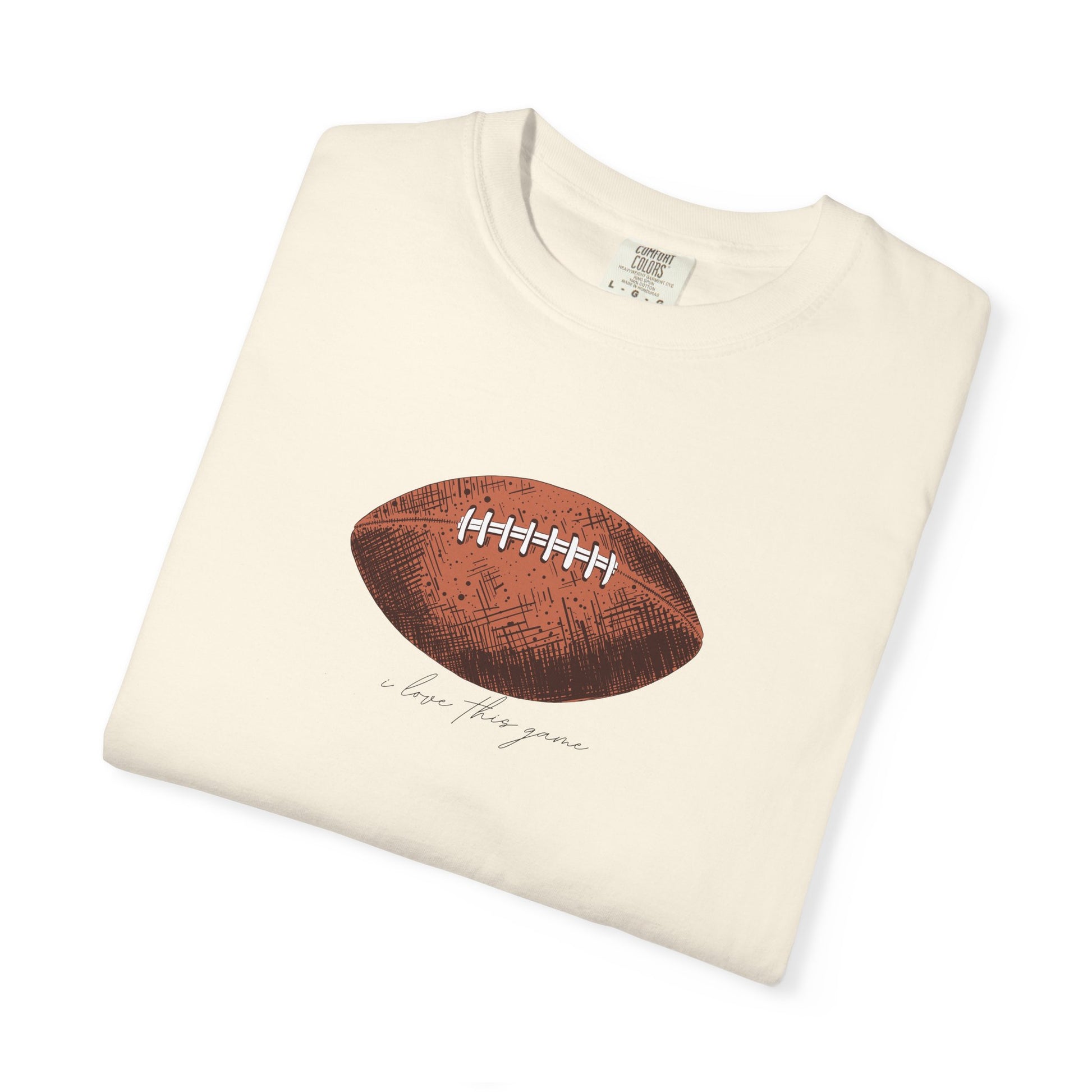 Folded cream-colored sweatshirt with a football graphic and text on a white background