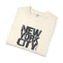 Folded cream t-shirt with 'New York City' text on a white background