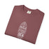 A folded dusty rose crewneck t-shirt with a white surfboard graphic containing the words 'I Weed Vitamins SEA' on a clean white background.