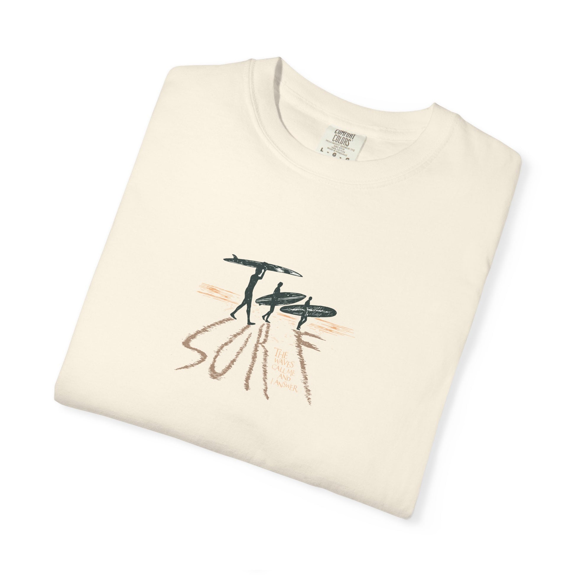 Folded cream-colored t-shirt with 'Scotland Summer '26' text and saltire design on a white background
