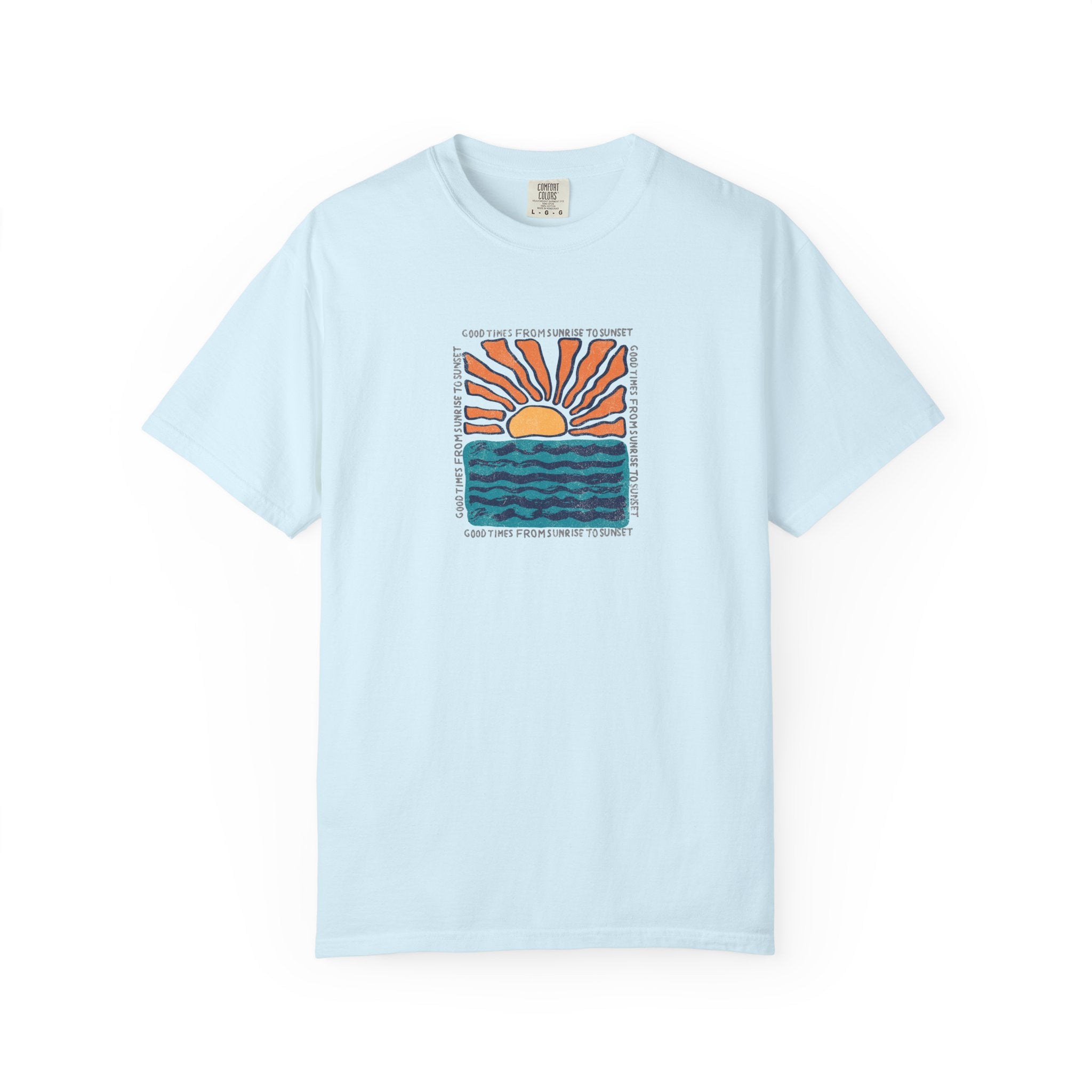 A light blue short-sleeve crewneck t-shirt featuring a central graphic of a sunset over wavy blue-green water, with the text 'I DON'T WANNA BE YOURS' printed around the design.