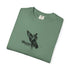 Folded green t-shirt with a black graphic on a white background