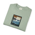 Folded green t-shirt with a graphic design on a white background