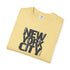 Folded yellow t-shirt with 'New York City' text on a white background