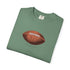 Folded green t-shirt with a brown football graphic on a white background