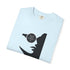 A folded light blue crewneck t-shirt with a black graphic print of a woman's face wearing a circular eyepatch with a pentagram design, shown on a white background.